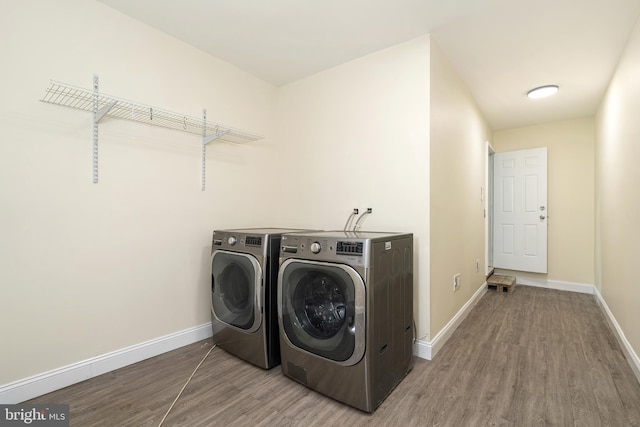76 Stonicker Dr, Lawrence, NJ 08648 - laundry room with washing machine and clothes dryer and wood finished floors