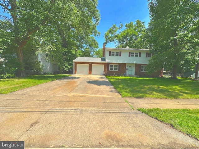 76 Stonicker Dr, Lawrence, NJ 08648 - view of front of home with an attached garage, a front lawn, driveway, brick siding, and a chimney