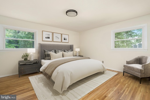 76 Stonicker Dr, Lawrence, NJ 08648 - bedroom featuring multiple windows and light wood-type flooring