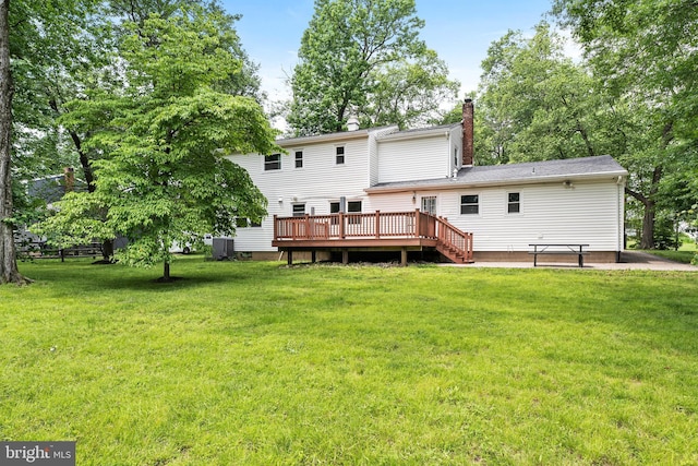 76 Stonicker Dr, Lawrence, NJ 08648 - rear view of house featuring a wooden deck, a chimney, and a lawn
