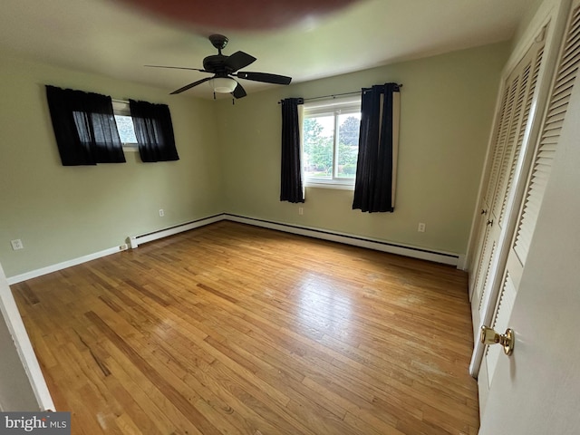 305 Reservoir Rd, Mechanicsburg, PA 17055 - unfurnished bedroom featuring light wood finished floors, a baseboard heating unit, and a ceiling fan