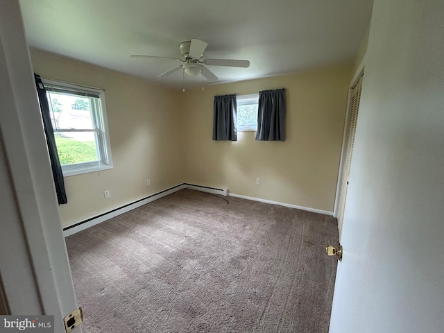305 Reservoir Rd, Mechanicsburg, PA 17055 - unfurnished bedroom with multiple windows, carpet floors, a ceiling fan, and a baseboard heating unit