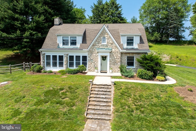 727 W Baltimore Pike, Kennett Square, PA 19348 - view of front facade with stone siding, a chimney, and roof with shingles