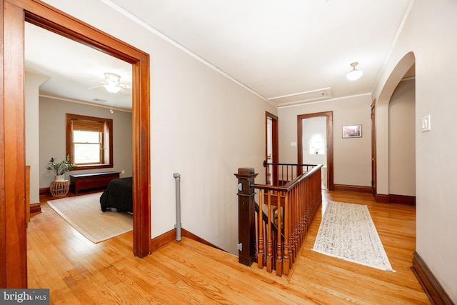 727 W Baltimore Pike, Kennett Square, PA 19348 - hallway featuring an upstairs landing, wood finished floors, crown molding, and arched walkways