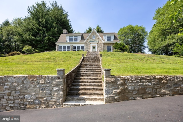 727 W Baltimore Pike, Kennett Square, PA 19348 - shingle-style home featuring a front lawn, stone siding, stairway, and a chimney