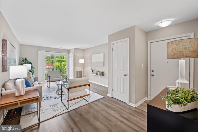 2050 N Calvert St Unit 410, Arlington, VA 22201 - living room featuring light wood-style floors and baseboards