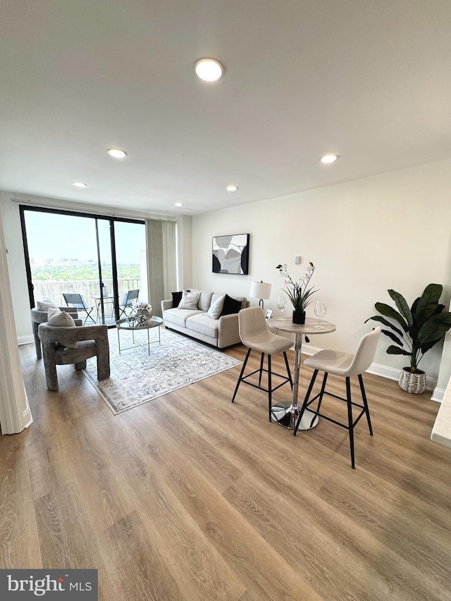 4141 N Henderson Rd Unit 1220, Arlington, VA 22203 - living room with wood finished floors and recessed lighting