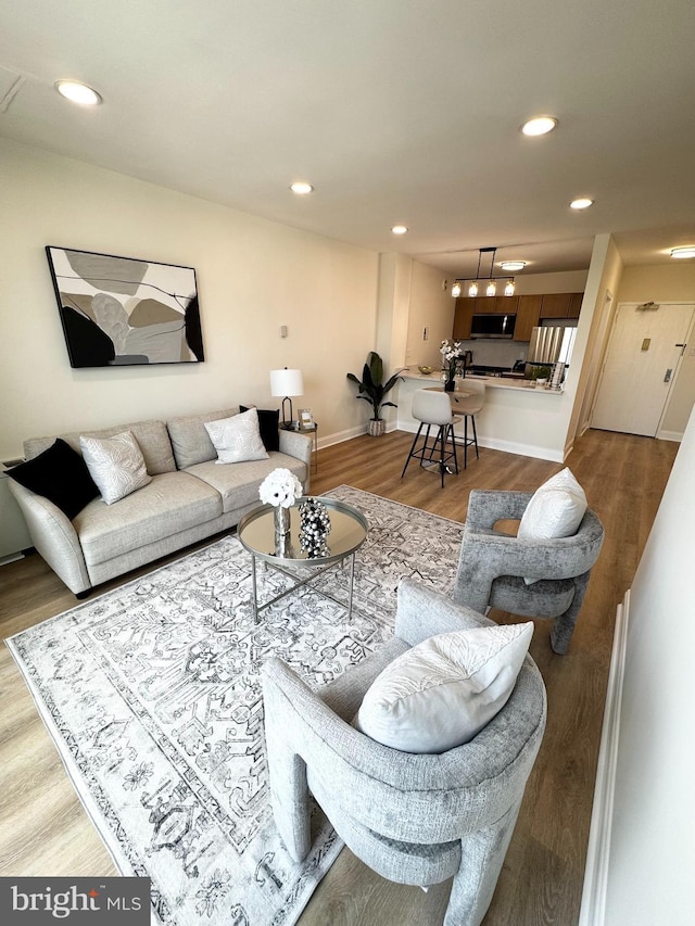 4141 N Henderson Rd Unit 1220, Arlington, VA 22203 - living area featuring wood finished floors and recessed lighting