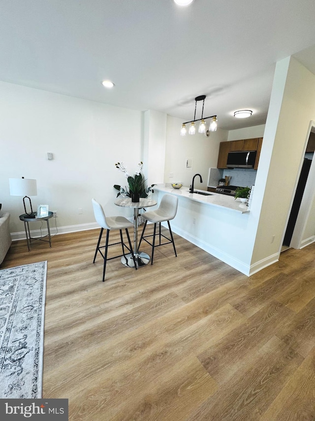 4141 N Henderson Rd Unit 1220, Arlington, VA 22203 - dining area featuring wood finished floors and recessed lighting