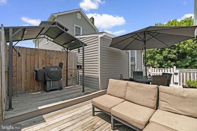 7615 Belmont Ave, Baltimore, MD 21224 - wooden deck featuring grilling area, outdoor dining space, and an outdoor hangout area