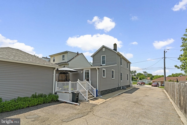7615 Belmont Ave, Baltimore, MD 21224 - rear view of house featuring a chimney