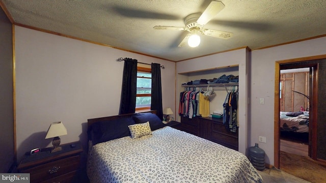 10495 Knobley Rd, Keyser, WV 26726 - carpeted bedroom with ornamental molding, a closet, a textured ceiling, and a ceiling fan