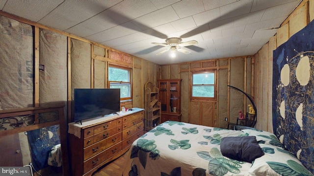 10495 Knobley Rd, Keyser, WV 26726 - bedroom with wood walls and a ceiling fan