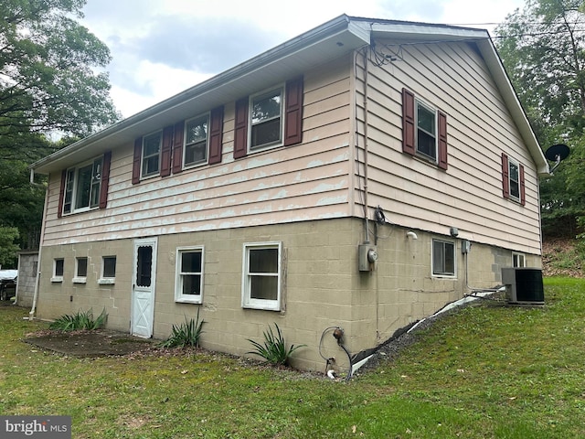 10495 Knobley Rd, Keyser, WV 26726 - view of side of home featuring a lawn and a central air condition unit