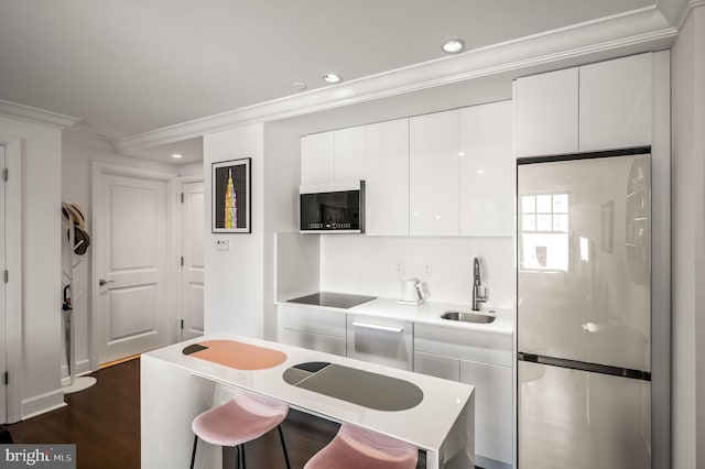 1701 Locust St Unit 1607, Philadelphia, PA 19103 - kitchen featuring freestanding refrigerator, ornamental molding, white cabinets, modern cabinets, and recessed lighting