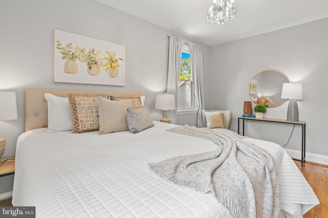 500 Maiden Choice, Catonsville, MD 21228 - bedroom featuring wood finished floors and a chandelier