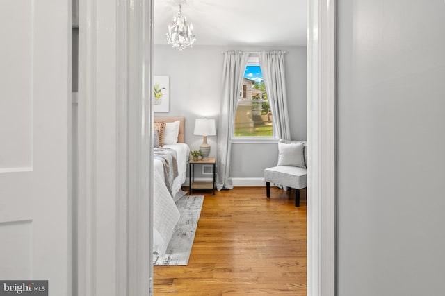 500 Maiden Choice, Catonsville, MD 21228 - bedroom featuring wood finished floors and a chandelier