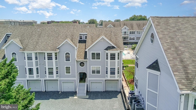 245 Blue Bill Ln Unit 245-D, Havre De Grace, MD 21078 - townhome / multi-family property featuring a garage, a shingled roof, and gravel driveway