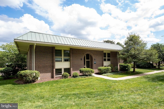 3360 Gleneagles Dr Unit 71-2B, Silver Spring, MD 20906 - view of front of house featuring brick siding, a front yard, and a standing seam roof