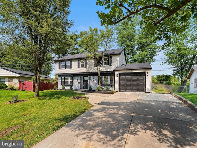 103 Hillcrest Ln, Willingboro, NJ 08046 - colonial inspired home featuring driveway, an attached garage, and brick siding