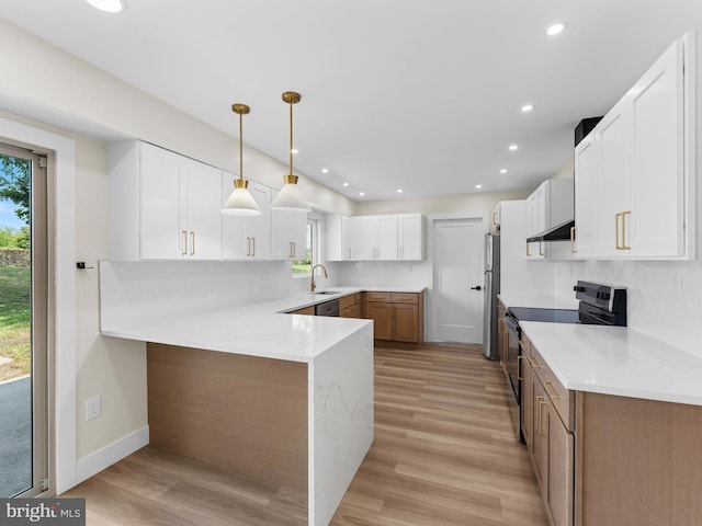 103 Hillcrest Ln, Willingboro, NJ 08046 - kitchen with stainless steel appliances, under cabinet range hood, a peninsula, healthy amount of natural light, and recessed lighting