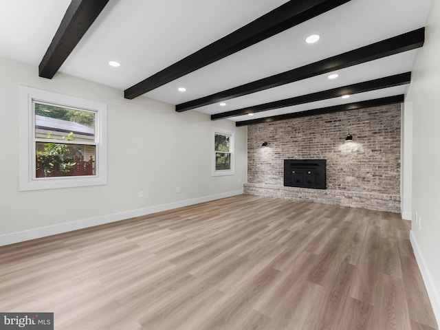 103 Hillcrest Ln, Willingboro, NJ 08046 - unfurnished living room with a brick fireplace, brick wall, beam ceiling, light wood-style floors, and recessed lighting