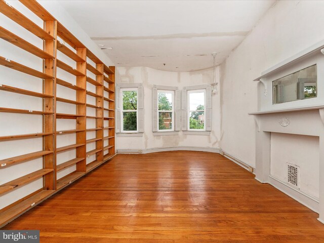 2700 Saint Paul St, Baltimore, MD 21218 - unfurnished living room featuring wood finished floors