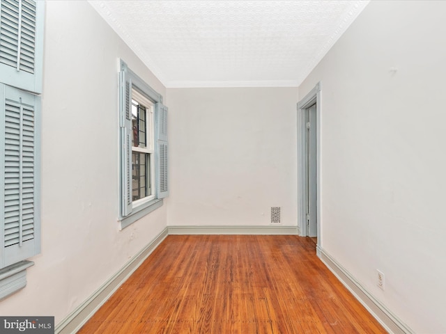 2700 Saint Paul St, Baltimore, MD 21218 - unfurnished room featuring wood finished floors and crown molding