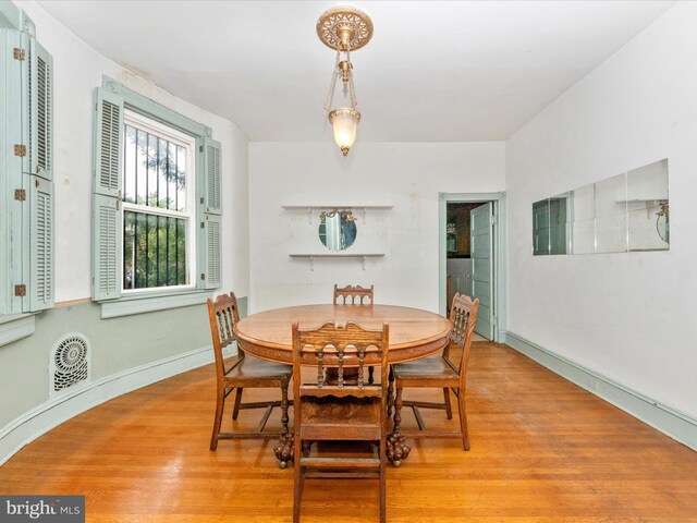 2700 Saint Paul St, Baltimore, MD 21218 - dining room featuring light wood-type flooring