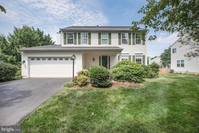 43076 Stonecottage Pl, Ashburn, VA 20147 - view of front of home featuring driveway, a front yard, and an attached garage