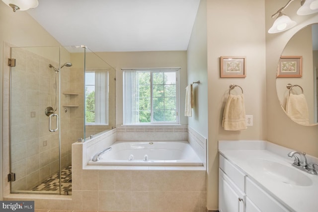 43076 Stonecottage Pl, Ashburn, VA 20147 - full bathroom featuring a garden tub, a shower stall, and vanity