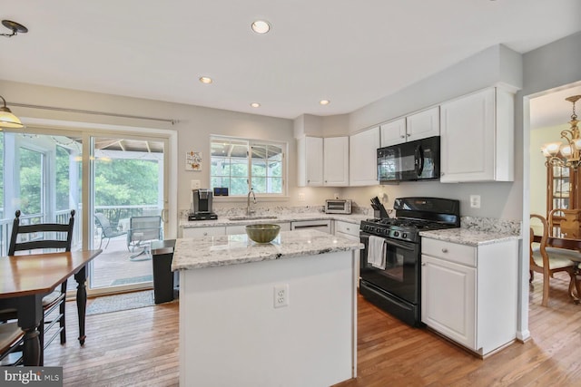43076 Stonecottage Pl, Ashburn, VA 20147 - kitchen with black appliances, white cabinetry, light wood-style floors, and recessed lighting