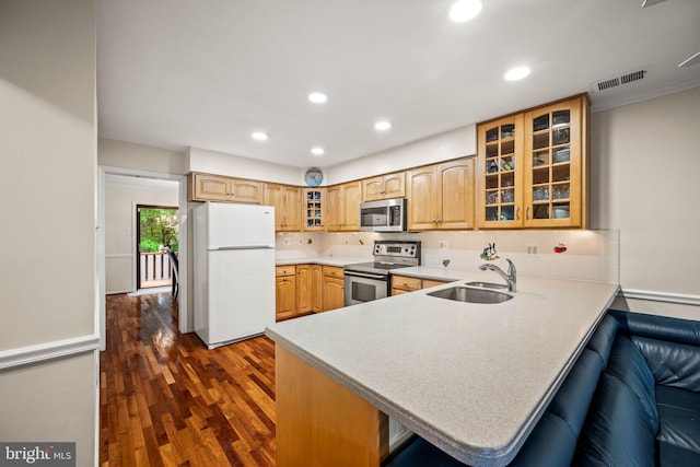 139 Putney Ln Unit 139, Malvern, PA 19355 - kitchen with appliances with stainless steel finishes, a peninsula, recessed lighting, glass insert cabinets, and dark wood-type flooring