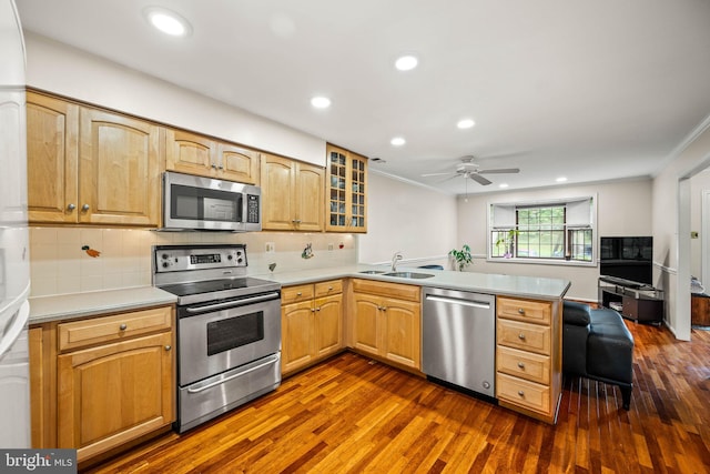 139 Putney Ln Unit 139, Malvern, PA 19355 - kitchen featuring appliances with stainless steel finishes, ornamental molding, a peninsula, dark wood-style floors, and ceiling fan