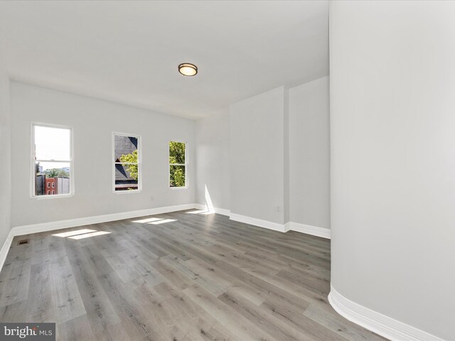 750 Dolphin St, Baltimore, MD 21217 - unfurnished room with baseboards and wood finished floors