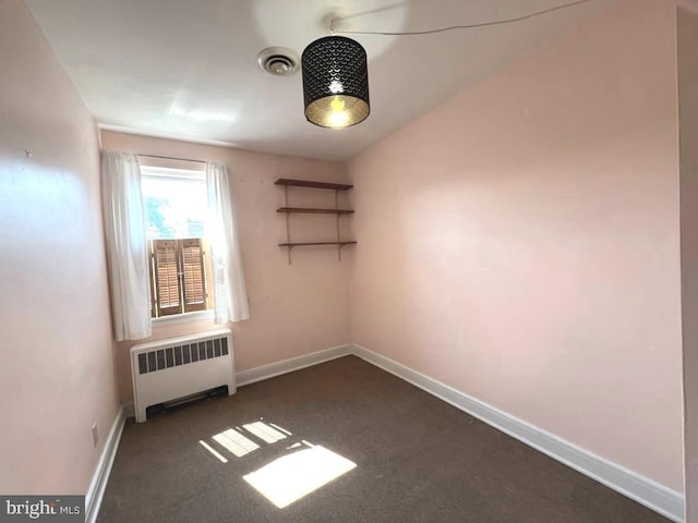 8544 Willow Oak Rd, Parkville, MD 21234 - unfurnished room featuring radiator heating unit and dark colored carpet