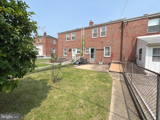 8544 Willow Oak Rd, Parkville, MD 21234 - back of property with a chimney, brick siding, and a patio