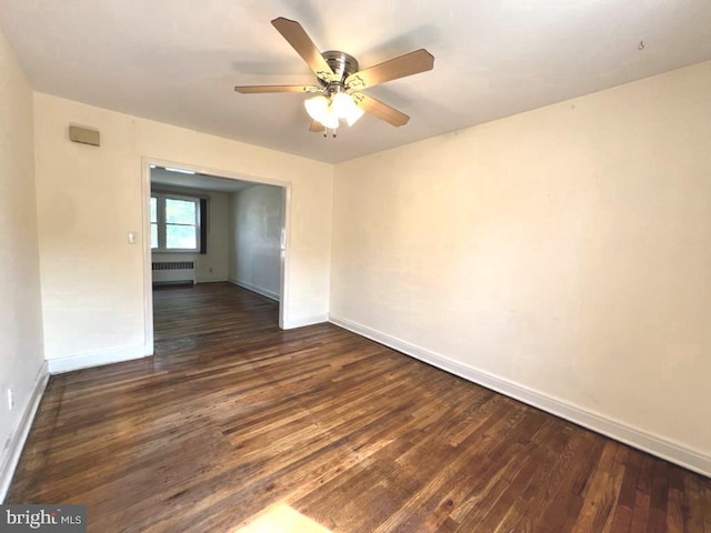 8544 Willow Oak Rd, Parkville, MD 21234 - empty room featuring radiator heating unit, dark wood-style floors, and ceiling fan