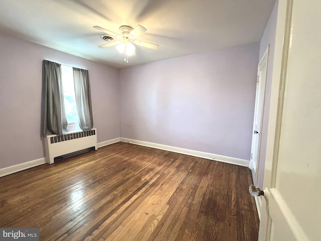 8544 Willow Oak Rd, Parkville, MD 21234 - spare room featuring radiator, ceiling fan, and dark wood-style flooring