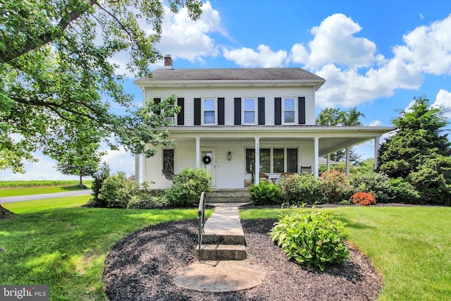 2540 Stoney Point Rd, East Berlin, PA 17316 - view of front facade with a chimney, a front yard, and a porch