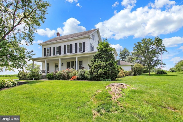 2540 Stoney Point Rd, East Berlin, PA 17316 - view of front of house with a chimney, covered porch, and a front lawn