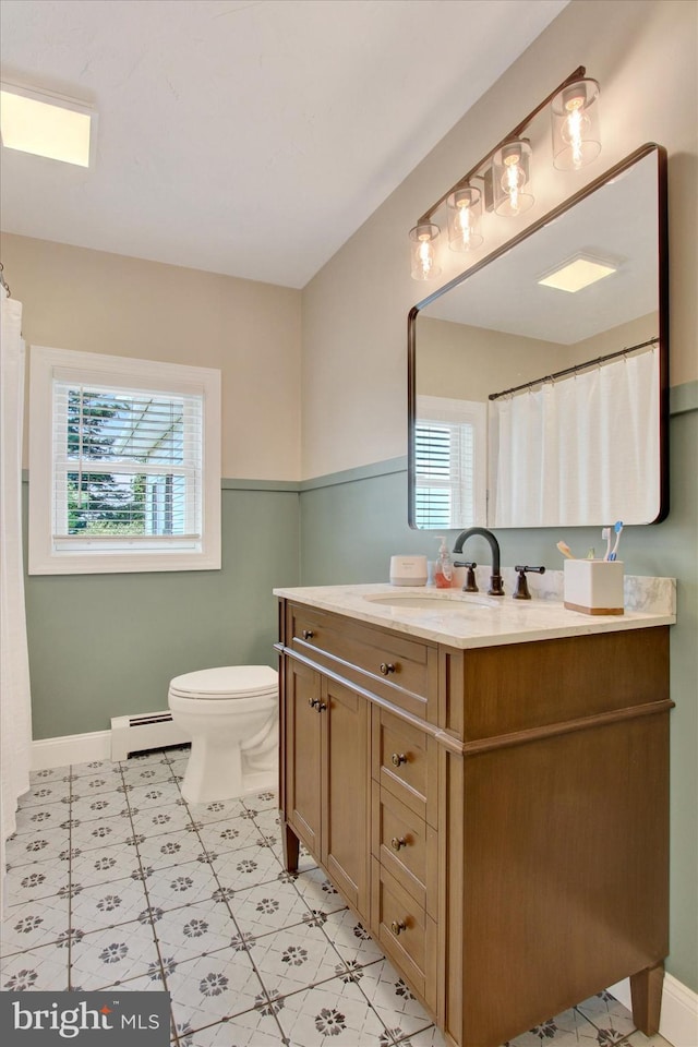 2540 Stoney Point Rd, East Berlin, PA 17316 - bathroom with a baseboard heating unit, vanity, healthy amount of natural light, and curtained shower