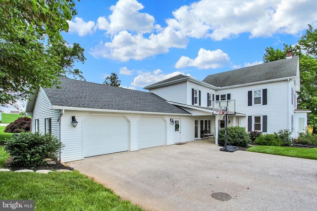 2540 Stoney Point Rd, East Berlin, PA 17316 - view of front facade featuring an attached garage, asphalt driveway, a chimney, a balcony, and roof with shingles