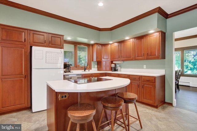 2540 Stoney Point Rd, East Berlin, PA 17316 - kitchen featuring freestanding refrigerator, black electric cooktop, ornamental molding, a breakfast bar, and brown cabinets