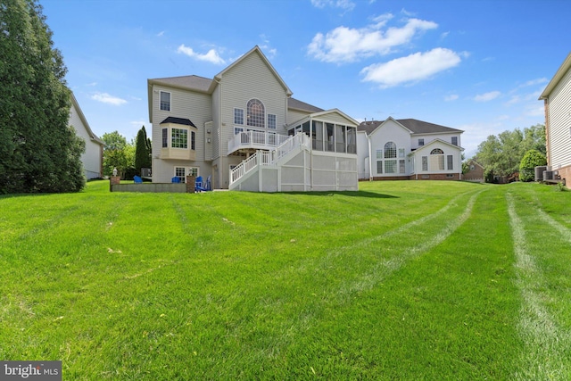 43146 Scenic Creek Way, Leesburg, VA 20176 - back of property featuring a sunroom, a yard, and stairs