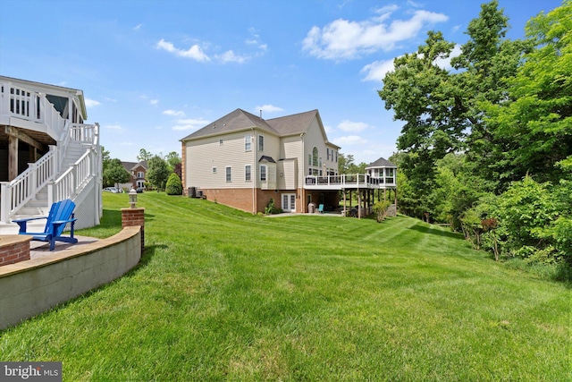 43146 Scenic Creek Way, Leesburg, VA 20176 - view of grassy yard with a wooden deck and stairway