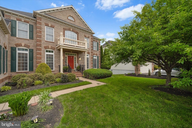 43146 Scenic Creek Way, Leesburg, VA 20176 - colonial inspired home with brick siding, a front yard, and a balcony
