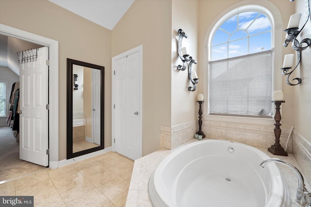 43146 Scenic Creek Way, Leesburg, VA 20176 - bathroom featuring a bath, lofted ceiling, and tile patterned floors