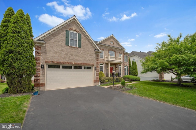 43146 Scenic Creek Way, Leesburg, VA 20176 - colonial-style house featuring brick siding, an attached garage, driveway, and a front yard