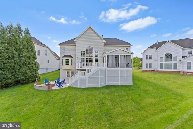 43146 Scenic Creek Way, Leesburg, VA 20176 - rear view of house with a sunroom, a fire pit, stairway, and a lawn